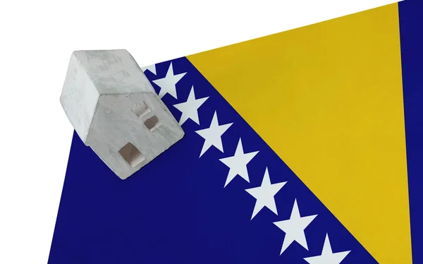 Small house on a flag - Bosnia Herzegovina — Stock Photo, Image