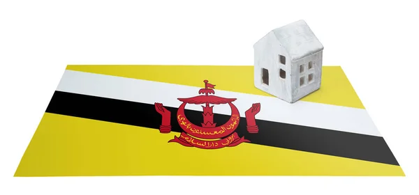 Pequeña casa en una bandera - Brunei — Foto de Stock