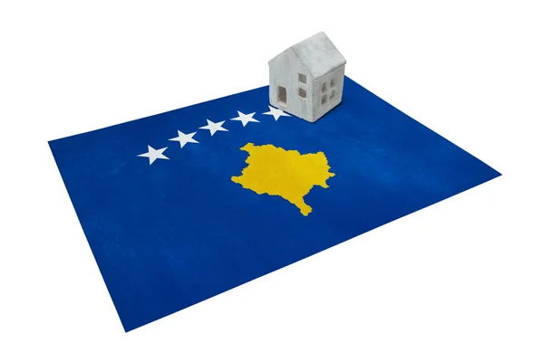 Small house on a flag - Kosovo — Stock Photo, Image