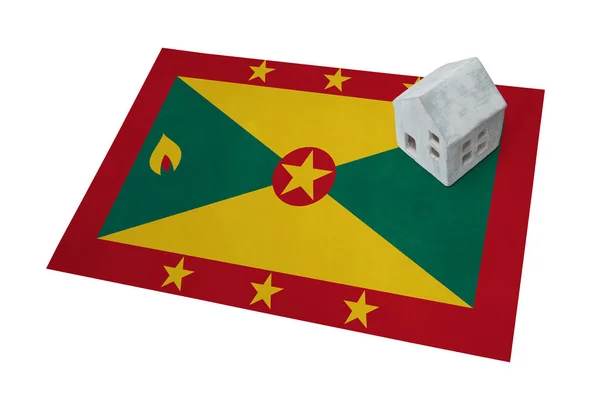 Bir bayrak - Grenada üzerinde küçük ev — Stok fotoğraf