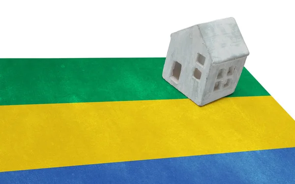 Small house on a flag - Gabon — Stock Photo, Image