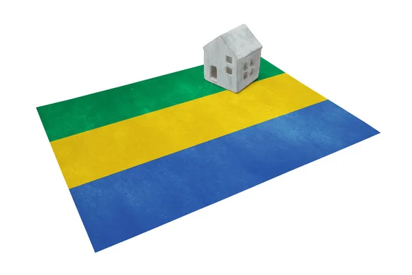 Small house on a flag - Gabon — Stock Photo, Image