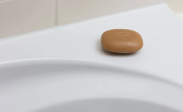 Used brown soap in a bathroom — Stock Photo, Image
