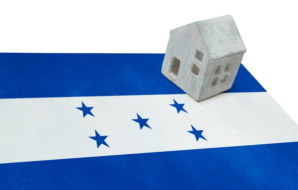 Pequeña casa en una bandera - Honduras — Foto de Stock