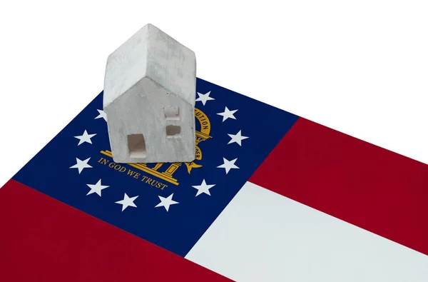 Litet hus på en flagga - Georgien — Stockfoto