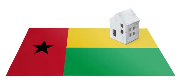 Small house on a flag - Guinea Bissau — Stock Photo, Image