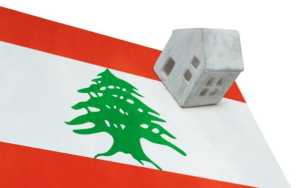 Litet hus på en flagga - Libanon — Stockfoto
