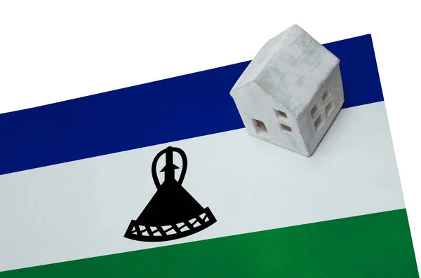 Litet hus på en flagga - Lesotho — Stockfoto