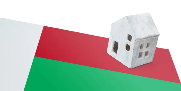 Small house on a flag - Madagascar — Stock Photo, Image