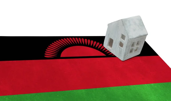 Litet hus på en flagga - Malawi — Stockfoto
