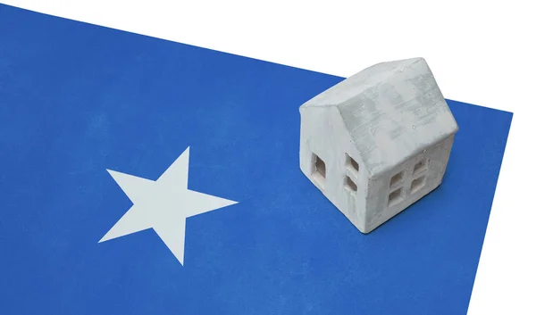Litet hus på en flagga - Somalia — Stockfoto