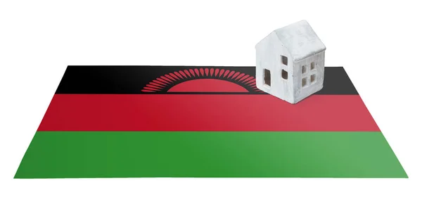 Litet hus på en flagga - Malawi — Stockfoto
