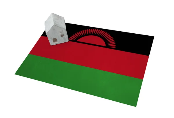 Small house on a flag - Malawi — Stock Photo, Image