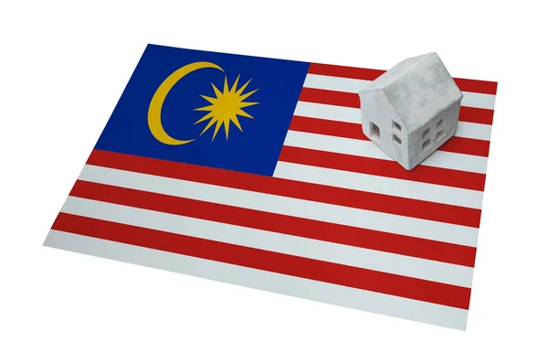 Small house on a flag - Malaysia — Stock Photo, Image