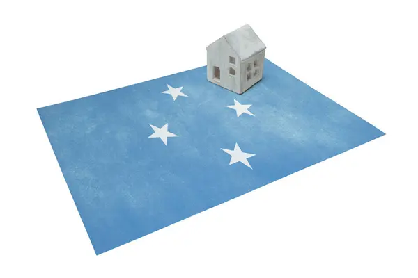 Malý domek na vlajce - Mikronésie — Stock fotografie