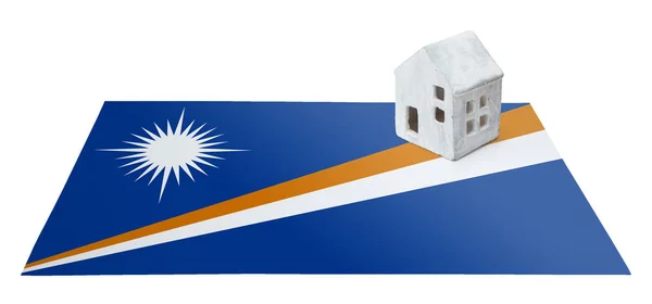 Small house on a flag - Marshall Islands — Stock Photo, Image