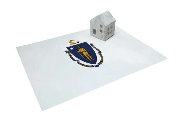 Small house on a flag - Massachusetts — Stock Photo, Image