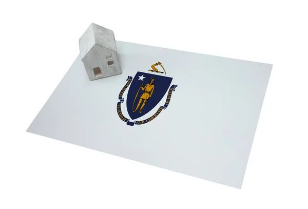 Small house on a flag - Massachusetts — Stock Photo, Image