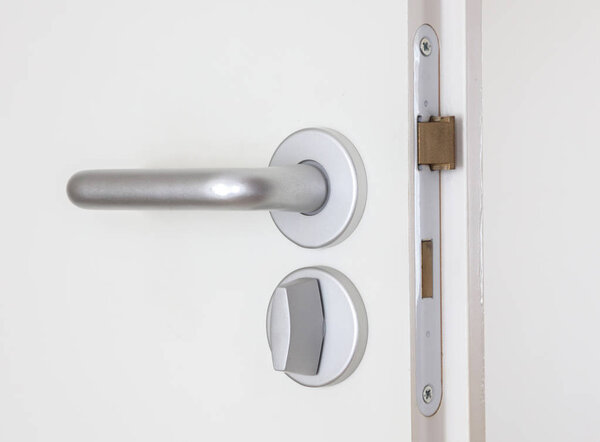 White door with chrome doorhandle