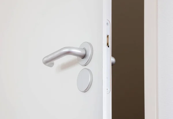 White door with chrome doorhandle — Stock Photo, Image