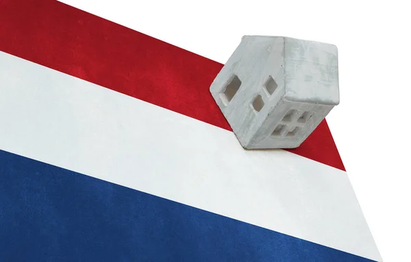 Small house on a flag - Netherlands — Stock Photo, Image