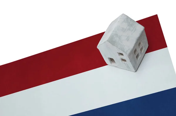 Small house on a flag - Netherlands — Stock Photo, Image