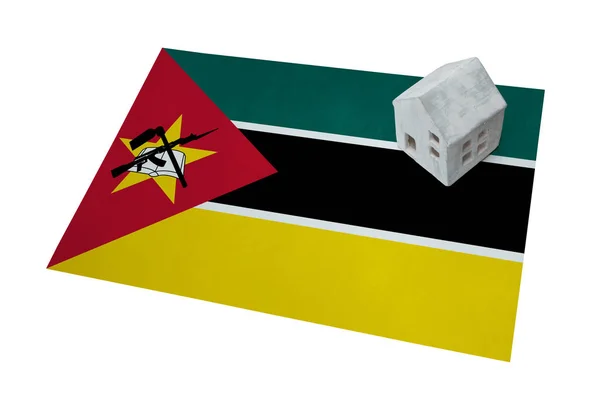 Small house on a flag - Mozambique — Stock Photo, Image