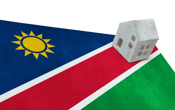 Petite maison sur un drapeau Namibie — Photo