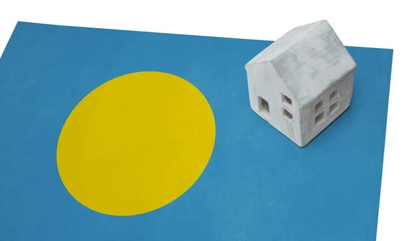 Small house on a flag - Palau — Stock Photo, Image