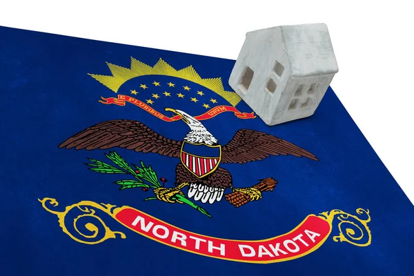 Small house on a flag - North Dakota — Stock Photo, Image