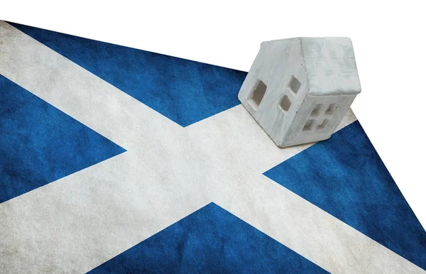 Small house on a flag - Scotland — Stock Photo, Image