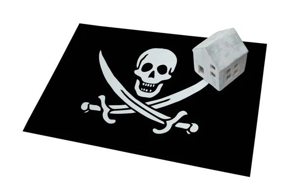 Piccola casa su una bandiera - Pirata — Foto Stock