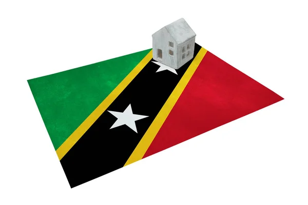 Small house on a flag - Saint Kitts and Nevis — Stock Photo, Image