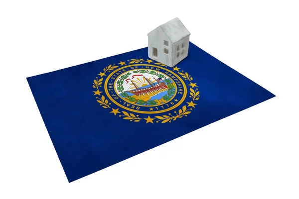 Small house on a flag - New Hampshire — Stock Photo, Image
