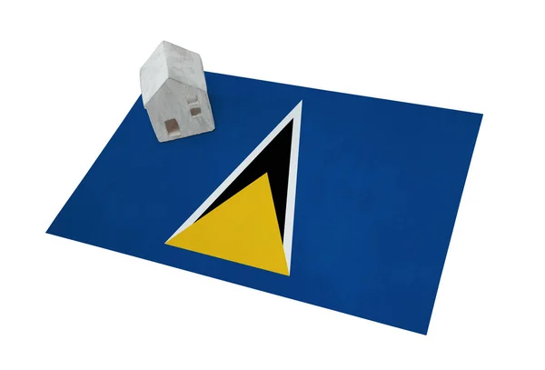 Small house on a flag - Saint Lucia — Stock Photo, Image