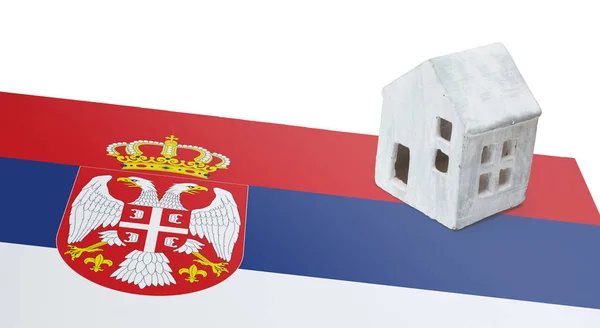 Small house on a flag - Serbia — Stock Photo, Image