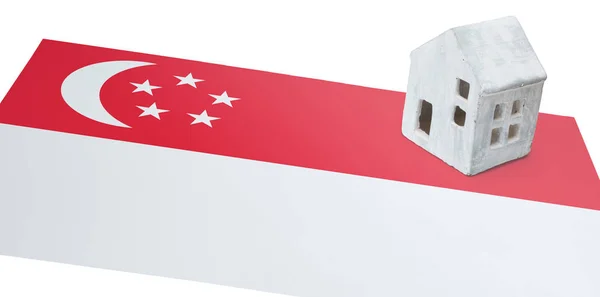 Small house on a flag - Singapore — Stock Photo, Image