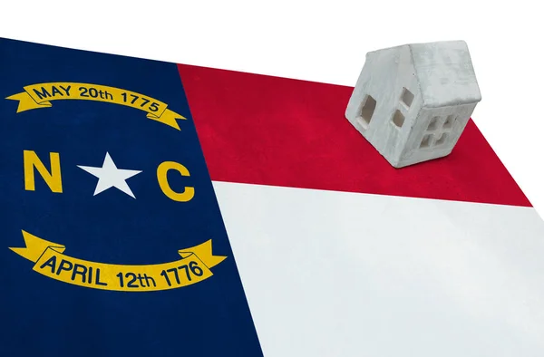 Small house on a flag - North Carolina — Stock Photo, Image