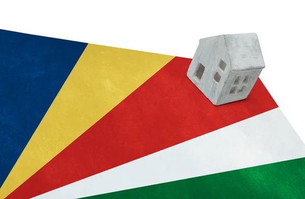 Small house on a flag - Seychelles — Stock Photo, Image