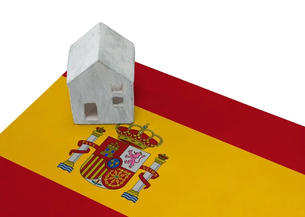 Litet hus på en flagga - Spanien — Stockfoto