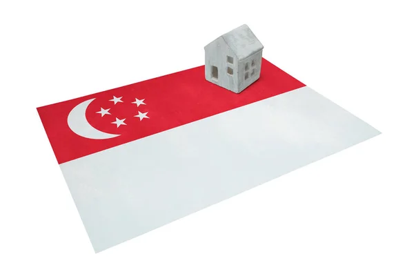 Litet hus på en flagga - Singapore — Stockfoto