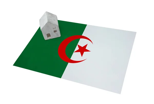 Small house on a flag - Algeria — Stock Photo, Image