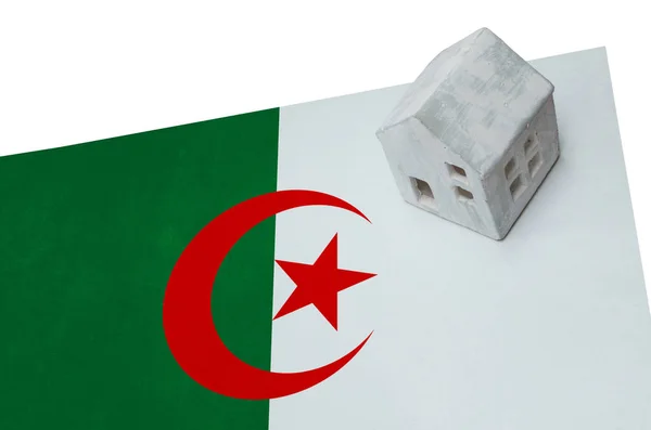 Small house on a flag - Algeria — Stock Photo, Image