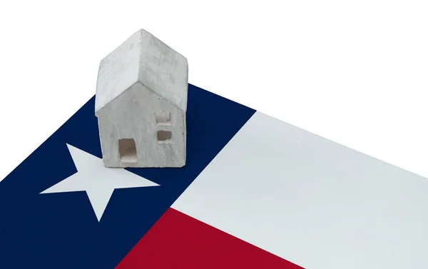 Litet hus på en flagga - Texas — Stockfoto