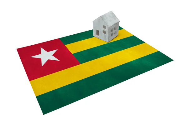 Small house on a flag - Togo — Stock Photo, Image
