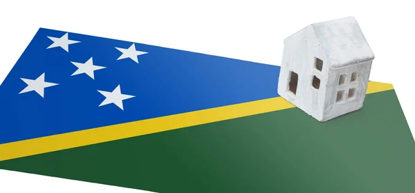 Small house on a flag - Solomon Islands — Stock Photo, Image