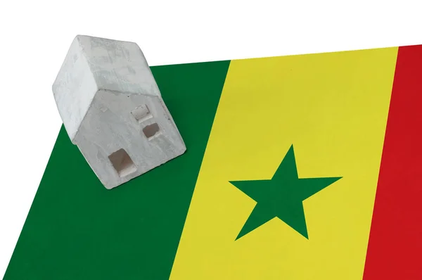 Small house on a flag - Senegal — Stock Photo, Image