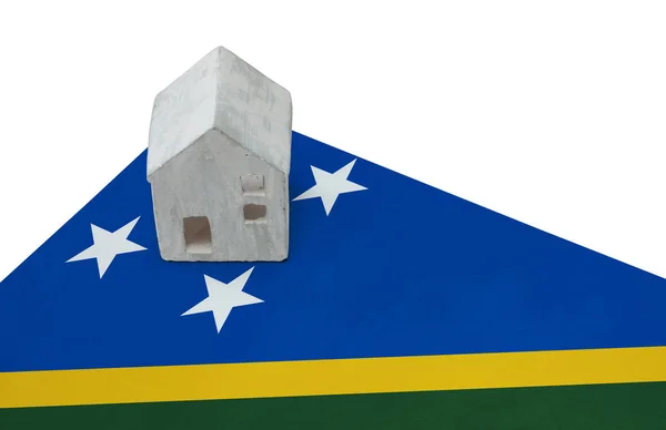 Small house on a flag - Solomon Islands — Stock Photo, Image