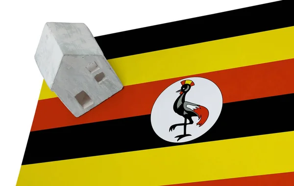 Small house on a flag - Uganda — Stock Photo, Image