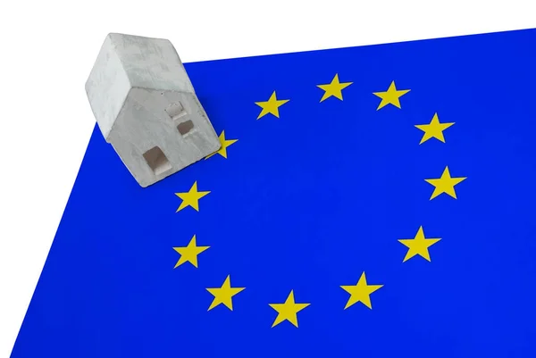 Small house on a flag - European Union — Stock Photo, Image